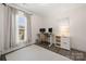 Bright office space with a standing desk, natural light, and modern shelving at 11400 Five Cedars Rd, Charlotte, NC 28226