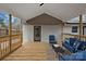 Covered porch with brick wall and seating area at 1213 Hartford Ave, Charlotte, NC 28209