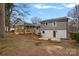 Home's backyard with patio and deck at 1213 Hartford Ave, Charlotte, NC 28209