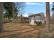 Spacious backyard with patio, shed, and mature trees at 1213 Hartford Ave, Charlotte, NC 28209