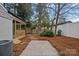 Landscaped backyard with patio and shed at 1213 Hartford Ave, Charlotte, NC 28209