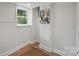 Spacious basement with wood floors and window at 1213 Hartford Ave, Charlotte, NC 28209