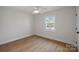 Light-filled bedroom with hardwood floors and ample natural light at 1213 Hartford Ave, Charlotte, NC 28209