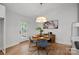 Charming dining room with round table and access to deck at 1213 Hartford Ave, Charlotte, NC 28209