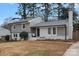 Newly renovated gray house with a well-maintained lawn at 1213 Hartford Ave, Charlotte, NC 28209