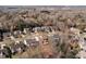 Community aerial view features tree-lined streets and single-Gathering homes in a serene neighborhood at 1221 Cochrane Woods Ln, Matthews, NC 28105