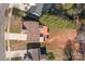 This overhead view showcases a home and deck in a large lot, with other homes nearby at 1221 Cochrane Woods Ln, Matthews, NC 28105