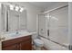 Functional bathroom featuring a vanity with sink and a tiled shower-tub combo for easy maintenance at 1221 Cochrane Woods Ln, Matthews, NC 28105