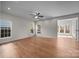 Spacious living room featuring hardwood floors, recessed lighting, and plenty of natural light from multiple windows at 1221 Cochrane Woods Ln, Matthews, NC 28105