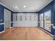 Bright living room featuring custom built-ins and natural light from a large window at 1221 Cochrane Woods Ln, Matthews, NC 28105