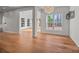 The living room has hardwood floors and plenty of natural light from large windows at 1221 Cochrane Woods Ln, Matthews, NC 28105