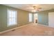 Bright bedroom featuring natural light and carpeted floors at 1243 Glory Ct, Oakboro, NC 28129