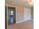 Neutral bedroom with a ceiling fan and carpeted floor, adjacent to a doorway at 1243 Glory Ct, Oakboro, NC 28129