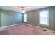 Well-lit bedroom with neutral walls and carpet flooring at 1243 Glory Ct, Oakboro, NC 28129