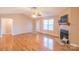 Spacious living room with hardwood floors and fireplace at 1243 Glory Ct, Oakboro, NC 28129