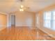 Bright living room boasting hardwood floors and a large window at 1243 Glory Ct, Oakboro, NC 28129