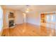 Spacious living room with hardwood floors and a fireplace that connects to the kitchen at 1243 Glory Ct, Oakboro, NC 28129