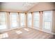 Bright sunroom featuring multiple windows and carpet flooring at 1243 Glory Ct, Oakboro, NC 28129