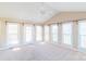 Sunroom with vaulted ceiling, multiple windows, and neutral decor at 1243 Glory Ct, Oakboro, NC 28129