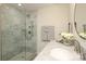 Clean bathroom with a walk-in shower and marble tile at 1300 Reece Rd # G-18, Charlotte, NC 28209