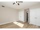 Well-lit bedroom with double closets and hardwood floors at 1300 Reece Rd # G-18, Charlotte, NC 28209