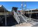 Exterior view of building entrance with stairs and covered walkway at 1300 Reece Rd # G-18, Charlotte, NC 28209