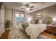 Cozy bedroom with a comfortable bed, ample natural light, and a ceiling fan at 1334 7Th Nw St, Hickory, NC 28601