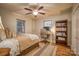 Charming bedroom with a built-in desk, a queen bed, and a large bookcase at 1334 7Th Nw St, Hickory, NC 28601