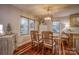 Bright dining room features hardwood floors and a charming table with four chairs at 1334 7Th Nw St, Hickory, NC 28601