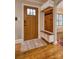 Inviting entryway with a built-in bench, coat rack, and hardwood flooring at 1334 7Th Nw St, Hickory, NC 28601