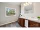 Bathroom featuring a double sink vanity and natural light at 137 S Penny St, Lancaster, SC 29720