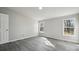 Bedroom featuring natural light, gray floors, and neutral walls at 137 S Penny St, Lancaster, SC 29720