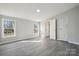 Bright bedroom features two windows and a light gray wood-look flooring at 137 S Penny St, Lancaster, SC 29720