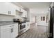 Modern kitchen featuring sleek stainless-steel appliances, granite countertops, and contemporary cabinets at 137 S Penny St, Lancaster, SC 29720