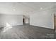 Spacious living room with neutral walls, gray floors, and recessed lighting at 137 S Penny St, Lancaster, SC 29720