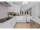 Modern kitchen with white cabinets and black countertops at 14028 Felix Ln # 3, Charlotte, NC 28277