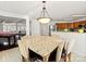 Kitchen breakfast nook with granite countertop and pendant lighting at 145 Ashton Woods Ct, Mount Holly, NC 28120