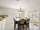 Breakfast nook with granite top table and sliding glass doors at 145 Ashton Woods Ct, Mount Holly, NC 28120