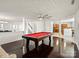 Open game room showcasing a pool table and kitchen view at 145 Ashton Woods Ct, Mount Holly, NC 28120