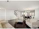 Living room with hardwood floors, white sofas, and a staircase at 145 Ashton Woods Ct, Mount Holly, NC 28120