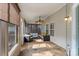 Relaxing screened porch with stone flooring and outdoor furniture at 145 Ashton Woods Ct, Mount Holly, NC 28120