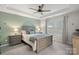 Spacious main bedroom featuring trey ceiling, a ceiling fan, and many windows for ample natural light at 16022 Red Buckeye Ln, Huntersville, NC 28078