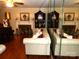 Living room with fireplace, piano, and large mirror at 1723 Oak St, Charlotte, NC 28269