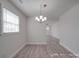 Bright dining room with chandelier and hardwood floors at 1740 Aaron Ave, Rock Hill, SC 29730