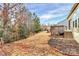 Extensive backyard view featuring a wooden deck and lush landscaping at 17563 Hawks View Dr, Fort Mill, SC 29707