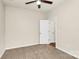 Bedroom with neutral carpet, ceiling fan, and interior door at 17563 Hawks View Dr, Fort Mill, SC 29707