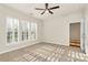 Cozy bedroom with neutral carpet, window with shutters, and ceiling fan at 17563 Hawks View Dr, Fort Mill, SC 29707