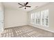 Cozy bedroom with neutral carpet, window with shutters, and ceiling fan at 17563 Hawks View Dr, Fort Mill, SC 29707