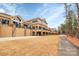 Elegant building exterior featuring stone accents, balconies, and a well-manicured lawn at 17563 Hawks View Dr, Fort Mill, SC 29707