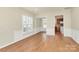 Inviting living room with gleaming hardwood floors and classic white wainscoting at 17563 Hawks View Dr, Fort Mill, SC 29707